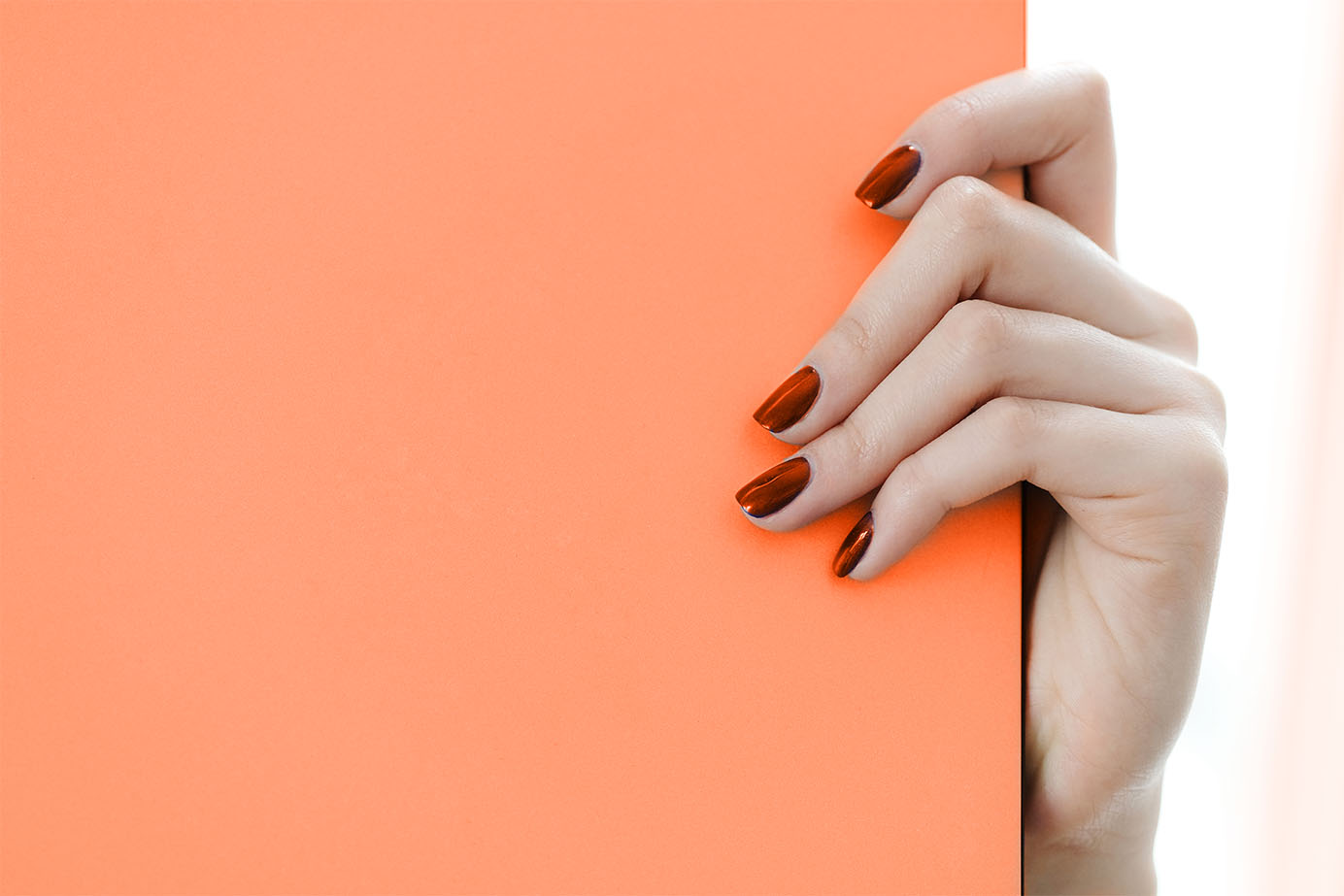 Refund Policy Beautiful nails of a girl reading refund policy of The Integrals.